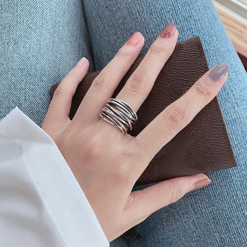 Adjustable silver layée ring