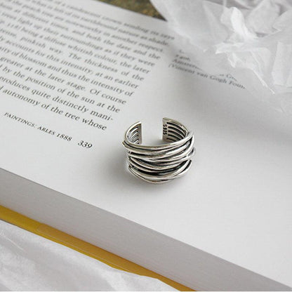 Adjustable silver layée ring