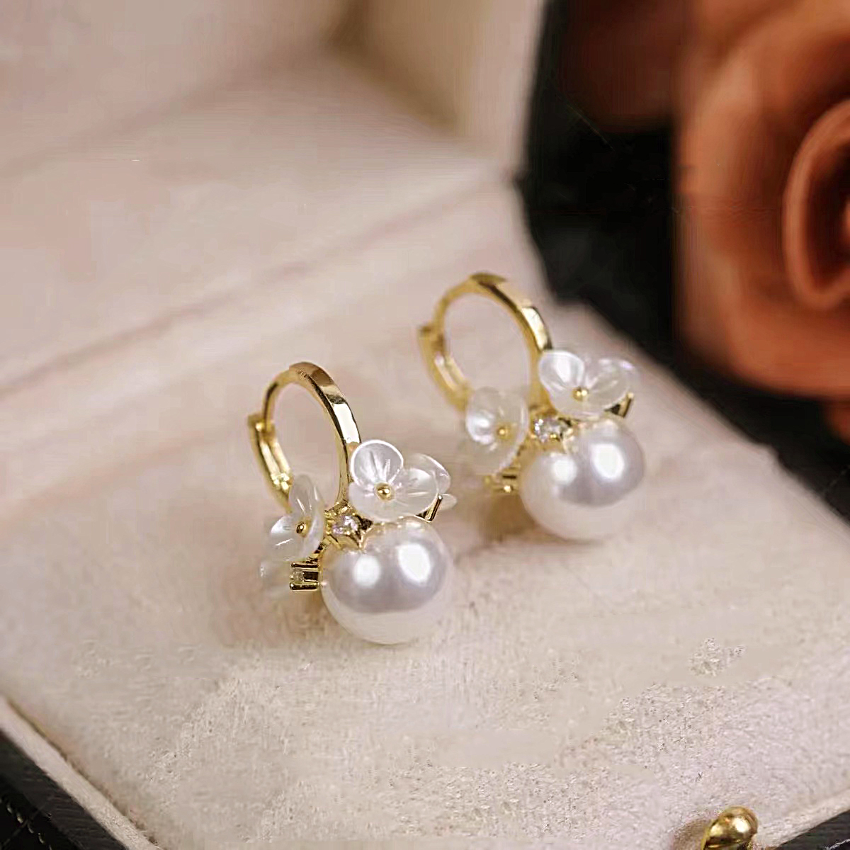 Elegant pearl earrings with flowers