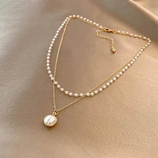 Elegant pearls in gold necklace